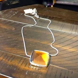 Silver necklace with amber colored stone